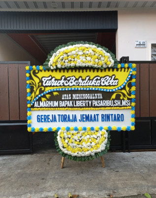 Papan Bunga Duka di Sukaharja